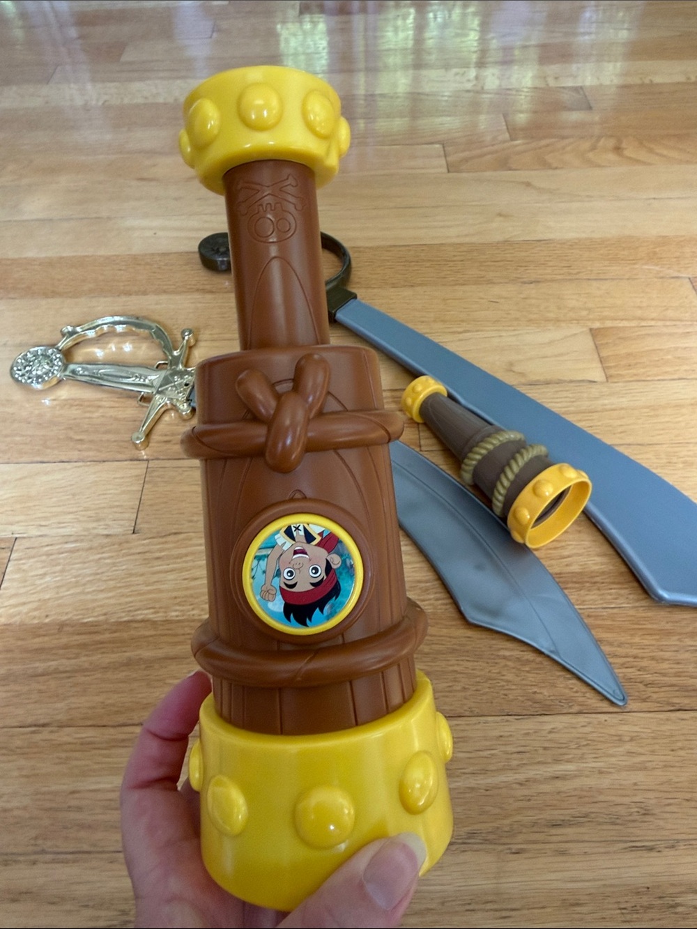 Pirate toys. 2 swords and 2 spyglasses (1 is a Jake and the Neverland Pirates)
